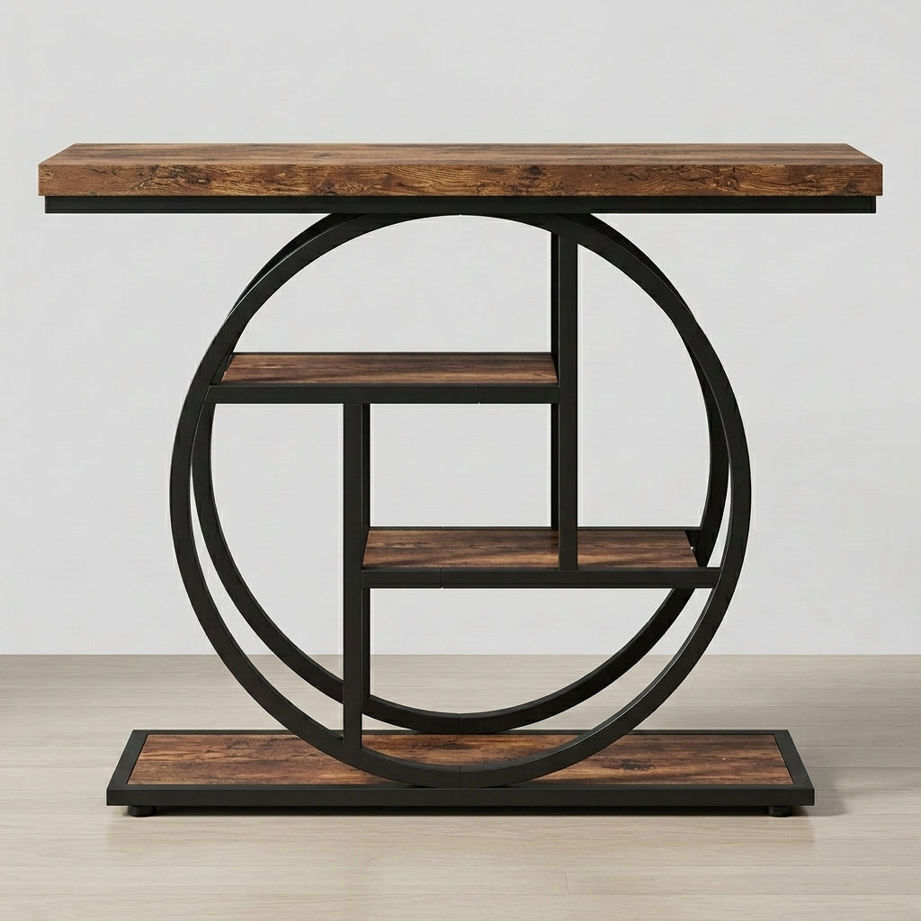 Industrial console table with a rustic brown wood top and shelves, supported by a black metal circular frame and base, shown against a neutral light gray background.