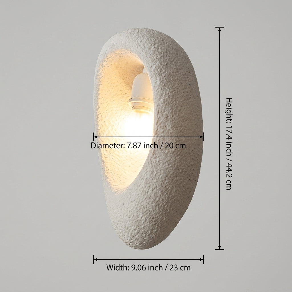 A textured white wall sconce with an integrated light bulb, showing dimension lines and labels for height, diameter, and width on a plain gray background.