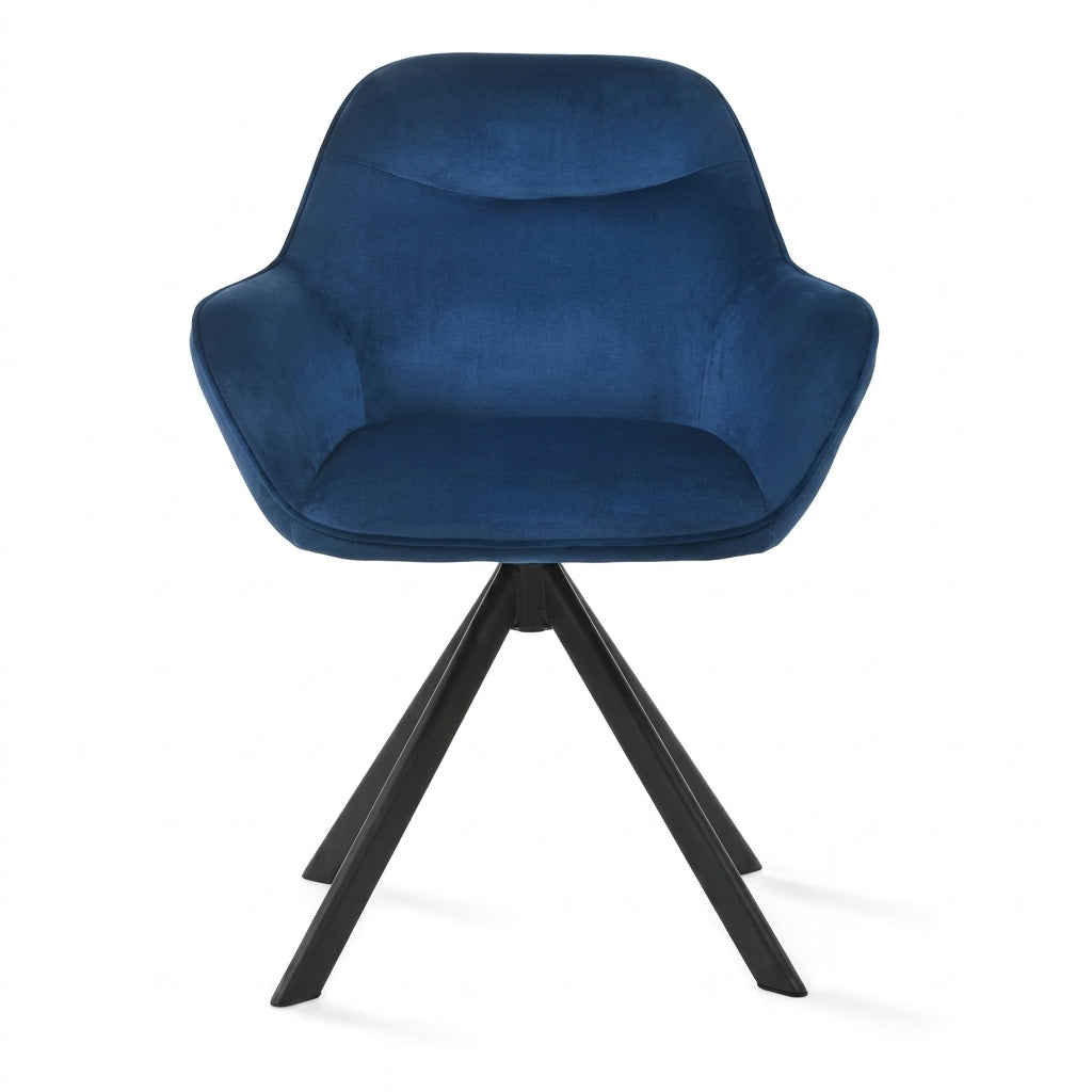 A modern swivel dining chair with a deep blue velvet upholstered seat and curved armrests, supported by a black metal tripod base, shown against a plain white background.