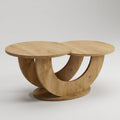 A modern wooden coffee table with two circular tabletops connected by a sculptural curved base, shown on a light gray studio background.