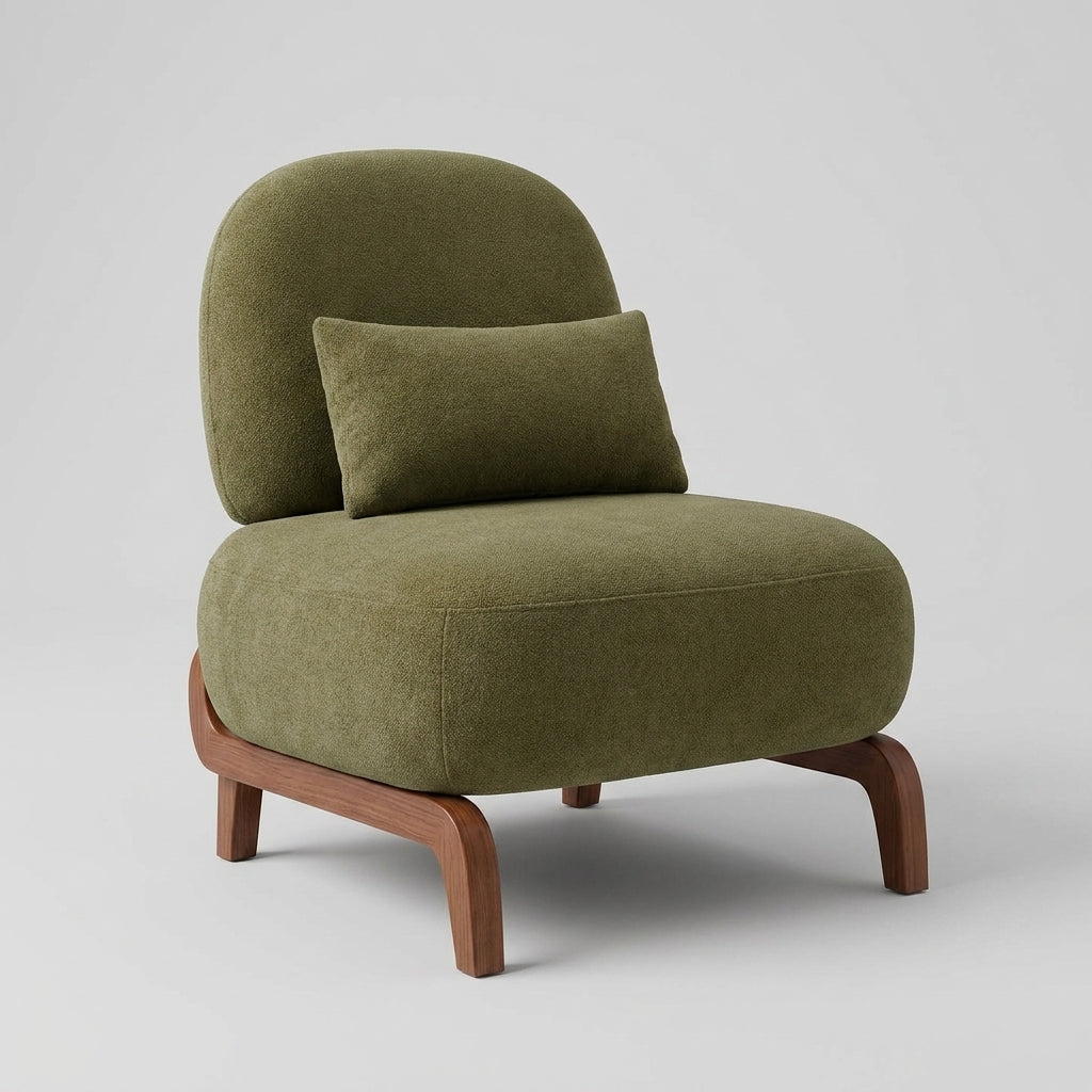 An olive green upholstered accent chair with a matching lumbar pillow and curved wooden legs, shown on a light gray studio background.